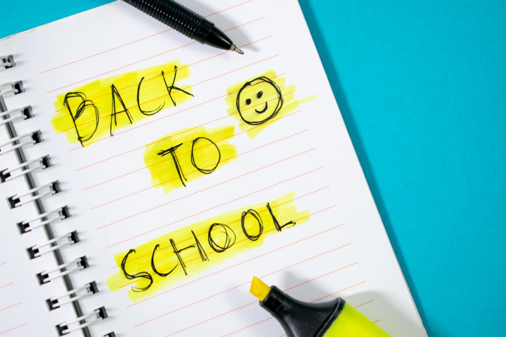 Notebook with writing Back to School with green stabilo