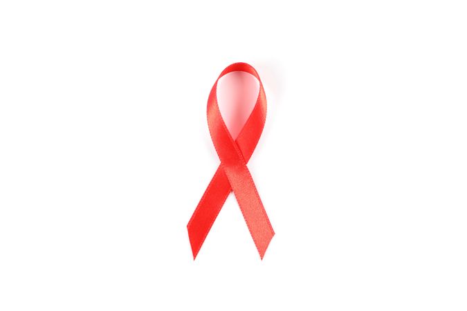 Red awareness ribbon isolated on blank background