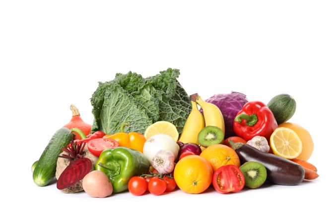 Pile of fresh vegetables and fruits isolated on plain background