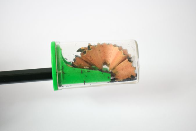 Side view of pencil with sharpener and shavings