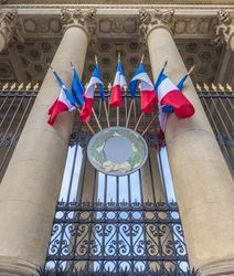 French flags on a historical building