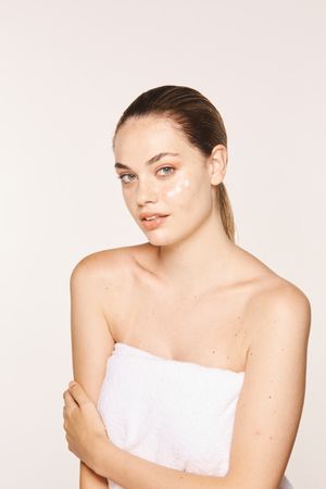 woman with cream on face