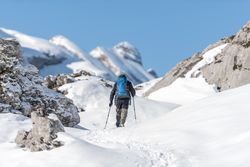 Anonymous skiing in mountainous terrain in winter