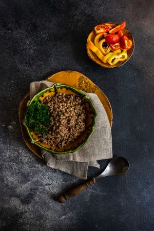 Bowl of buckwheat and vegetables on counter