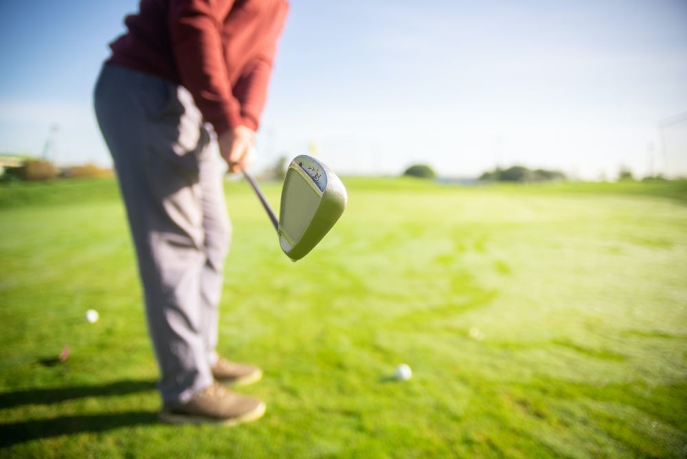 Man about to hit the golf ball