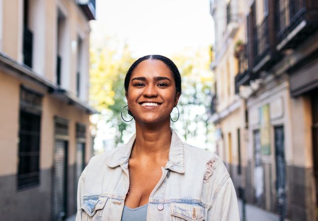 Portrait of a cheerful Black Latina young woman outdoors
