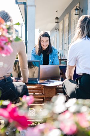 Women giving support and helping each other revising together for university exams and tests.