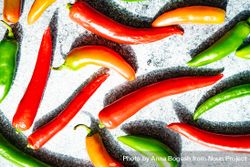 Top view of spicy peppers on grey kitchen counter 5pgqjy
