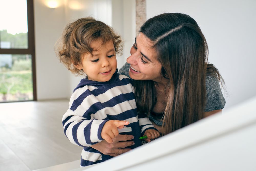 Happy mother talking with adorable son