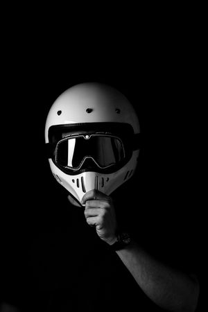 Rider in helmet and glasses at studio