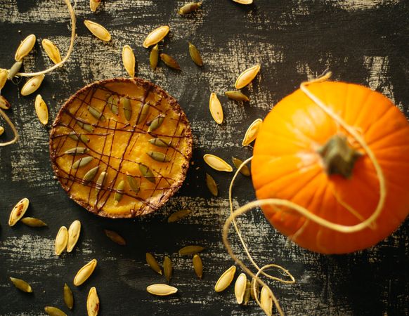 Top view of pie beside pumpkin