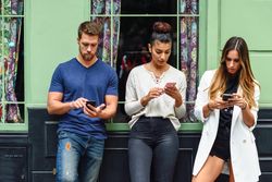 Multiracial group of friends chatting outside