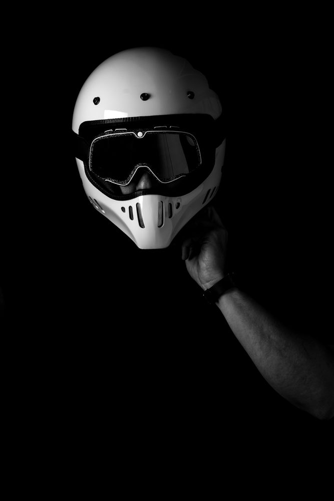 Rider in helmet and glasses at studio