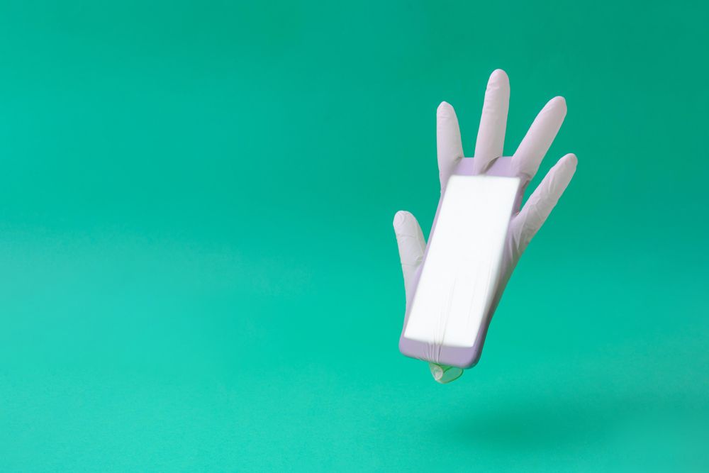 Surgical latex glove and mobile phone