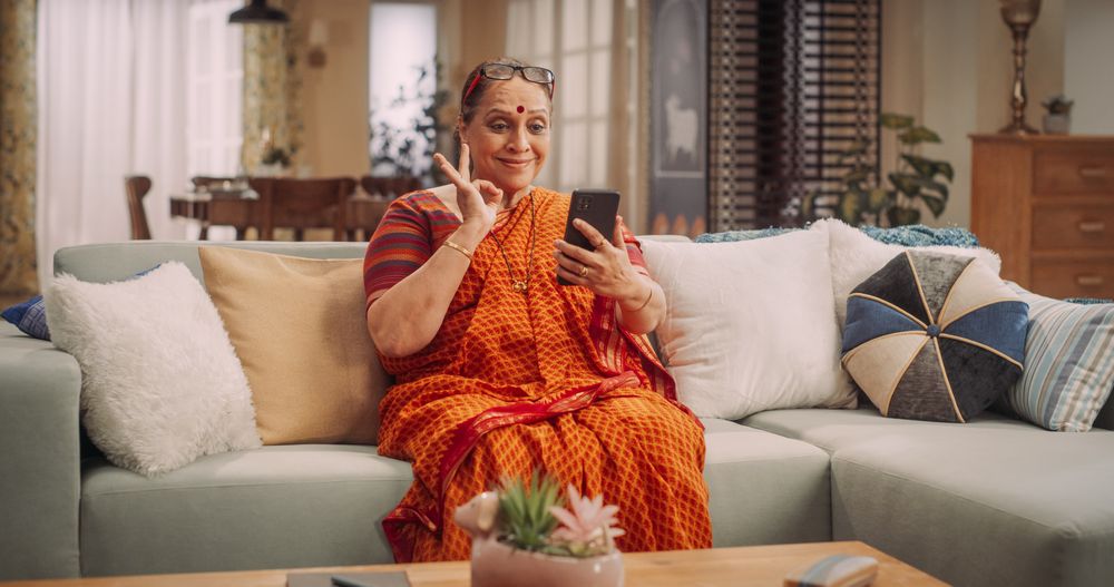 Mature Indian Woman Using Video Call on Smartphone
