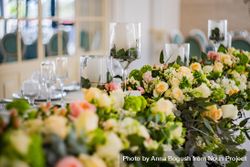 Wedding floral arrangement on long table 4BaaOW