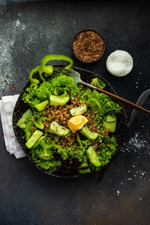 Green fresh salad on concrete background with copy space