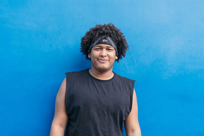 Portrait of a Black man with Afro hair in the open air