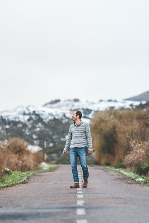 Man walking on country road