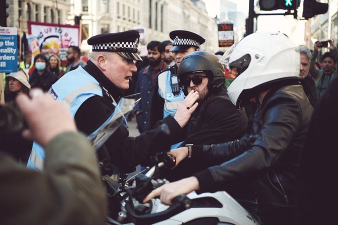 London, England, United Kingdom - March 19 2022: Police clash with 2 people in helmets