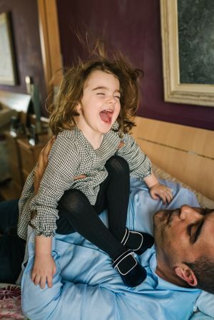Father playing with daughter