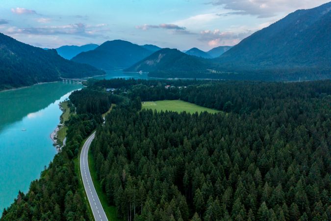 Drone aerial view with forest and Sylvenstein Lake in the Bavarian Alps, Germany