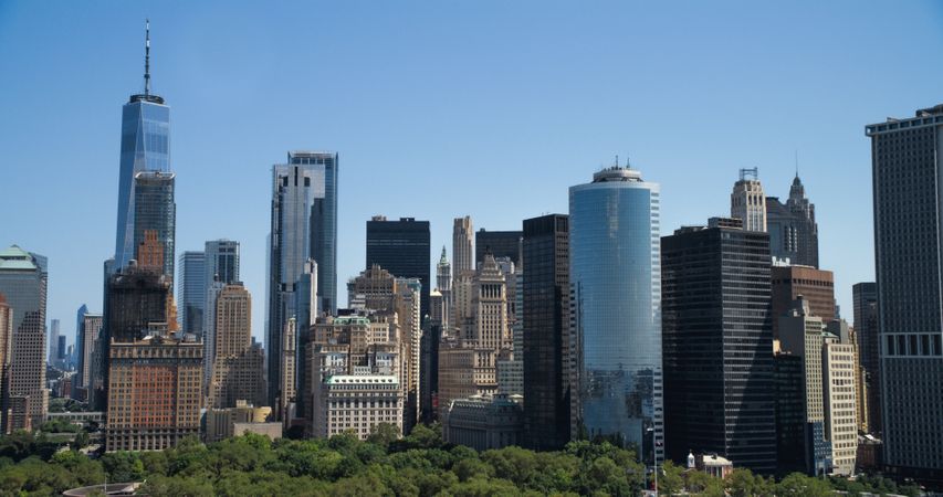 Scenic Aerial New York City View of Lower Manhattan Architecture. Panoramic Downtown Footage from a Helicopter During a Sunny Day. Cityscape with Modern Office Buildings and Historic Skyscrapers
