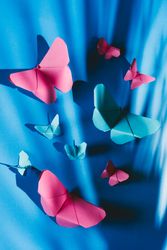 Paper butterflies on silk cloth