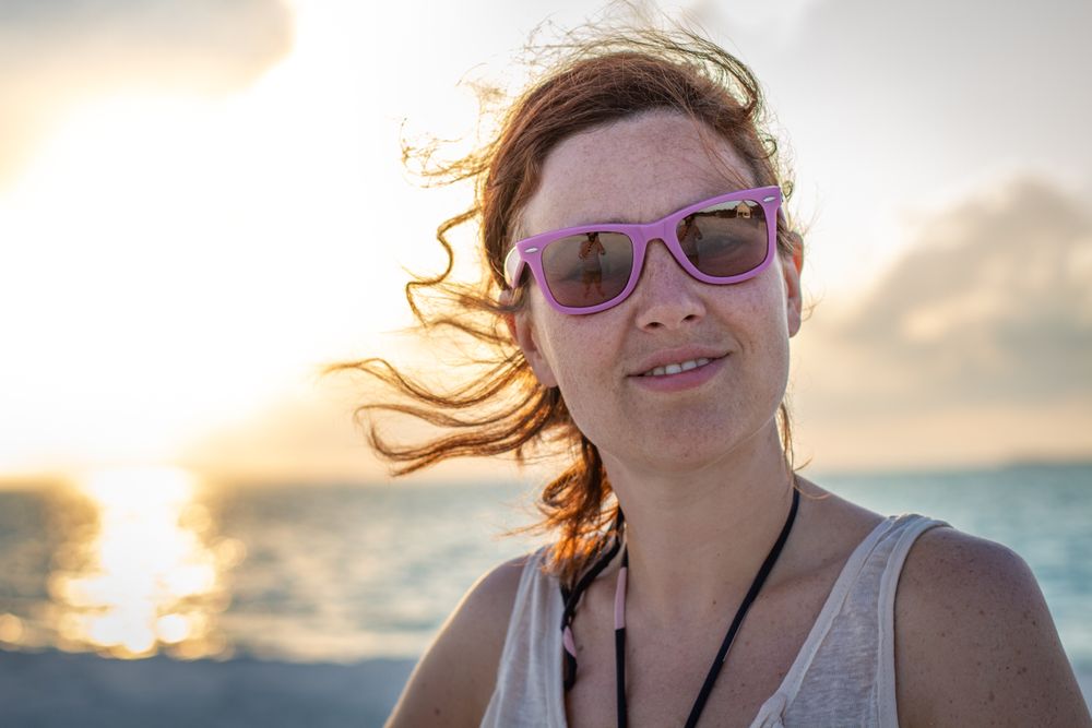 Woman in sunglasses at the beach