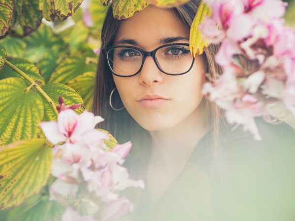 Portrait of woman among blooming trees