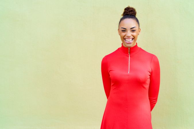 Smiling female in casual red dress