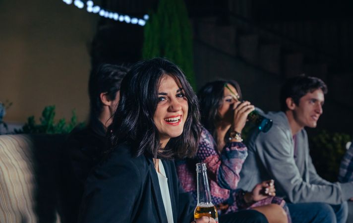 Smiling brunette woman at a party
