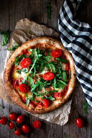 Appetizing pizza placed on wooden table