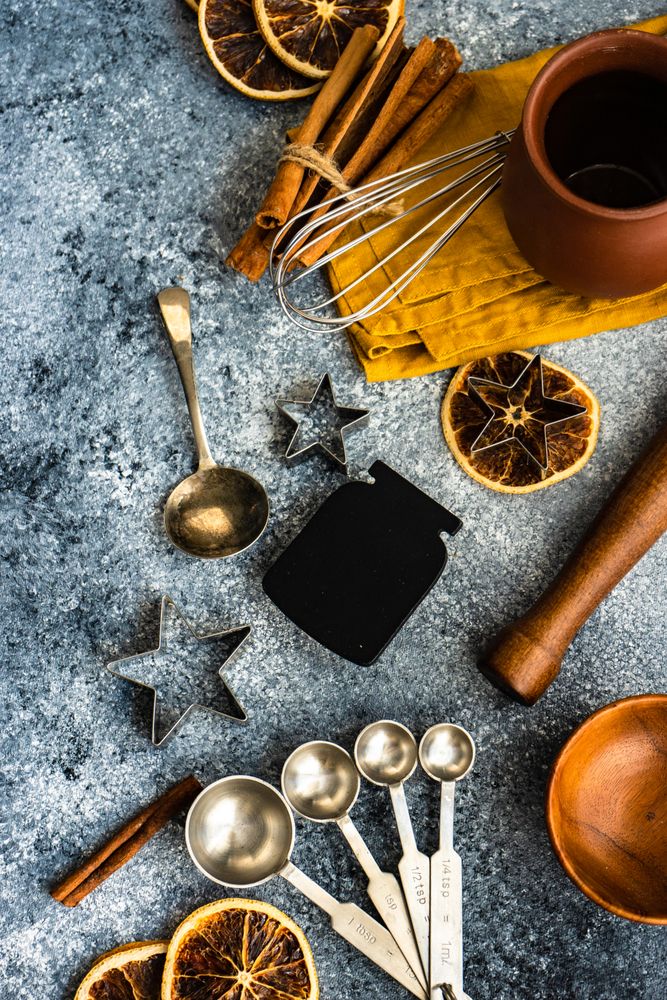 Christmas cookie baking equipment on stone background