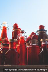 Glass bottles and jars with strawberries syrup 5ld7Y5
