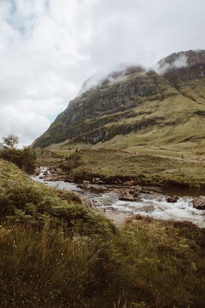 Mountain river with stones on daytime