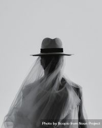 Grayscale photo of man wearing a hat with veil 563dL4