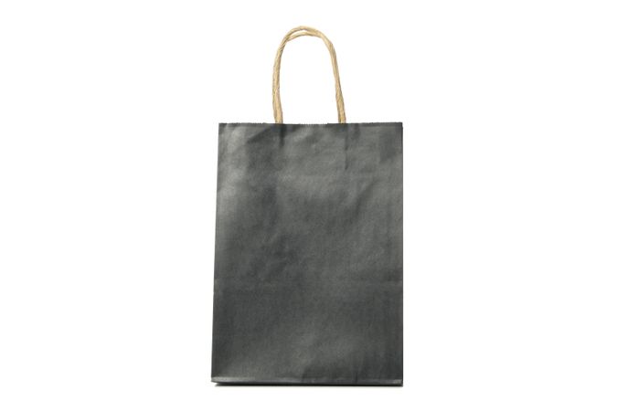 dark paper bag isolated on light background