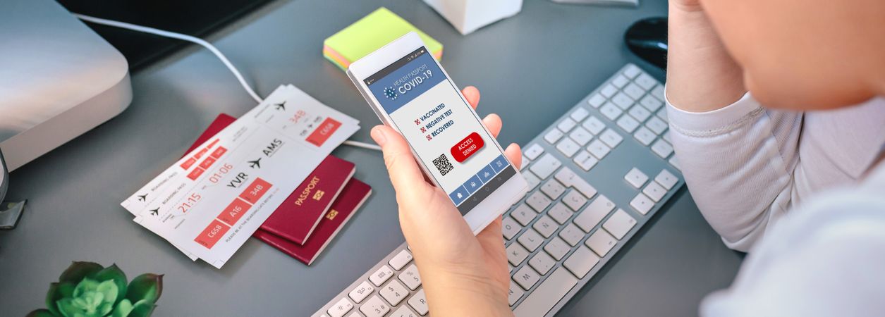 Worried woman looking denied covid health passport on mobile whi