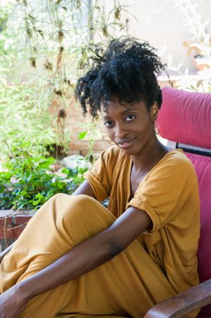 Portrait of Black woman looking at camera and smiling