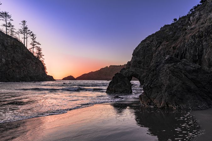 Cliffs on the west coast at dusk with beautiful purple orange sky