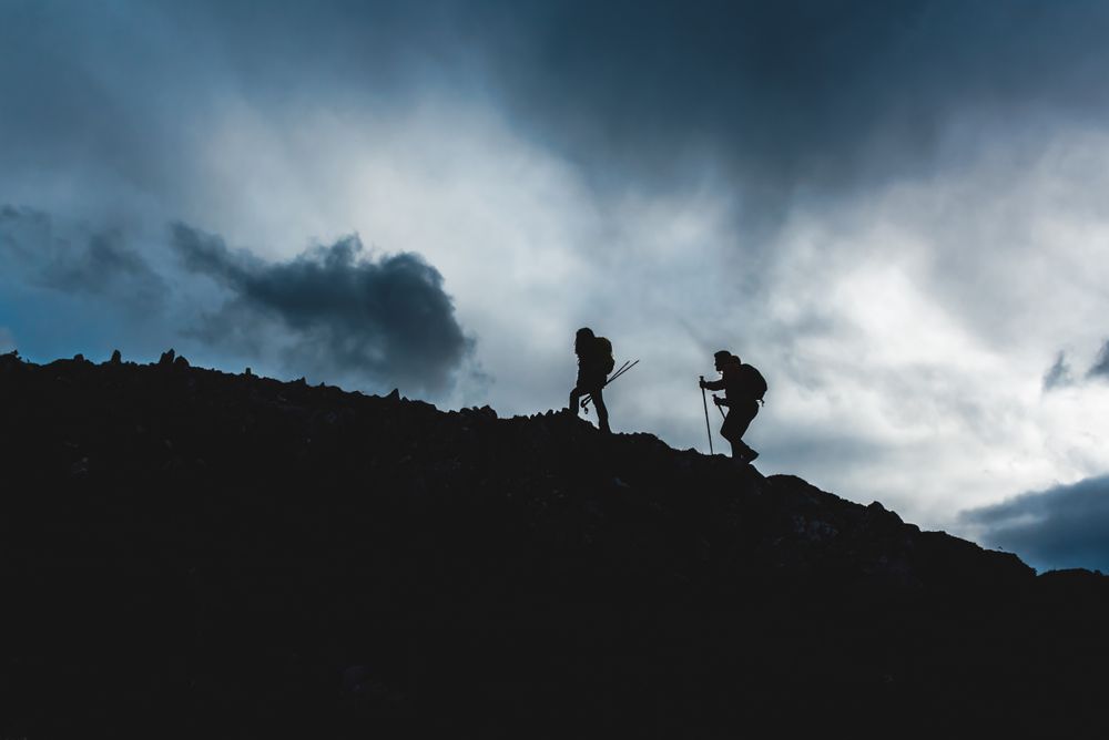 mountaineers hiking in the mountains