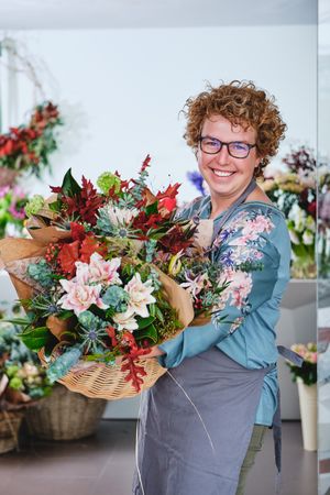 Happy woman with bouquet of flowers