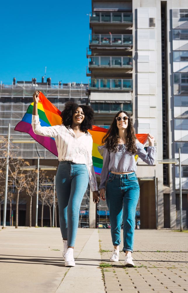 Female couple with LGBT flag