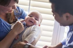 Couple Enjoying Their Newborn Son