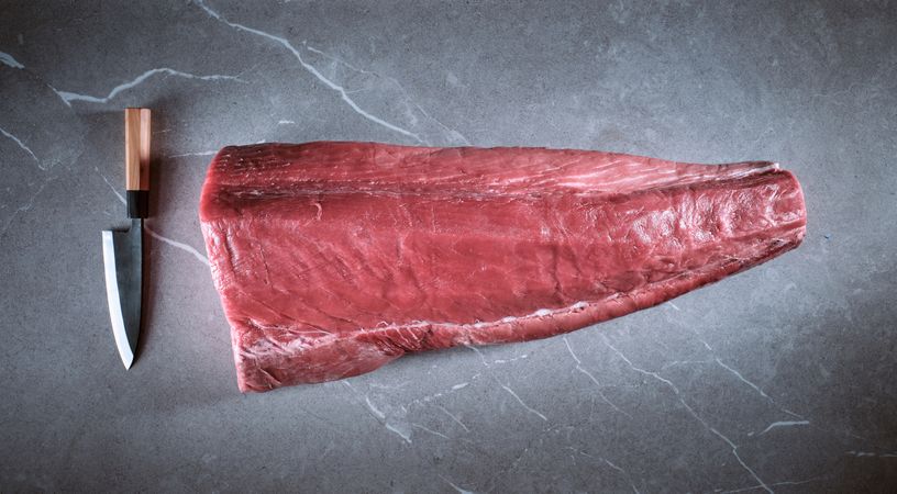 Fresh raw tuna on kitchen table