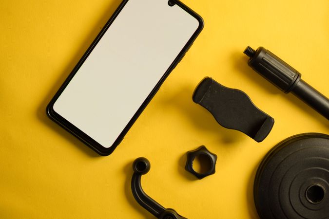 Mock up phone and accessories on yellow background