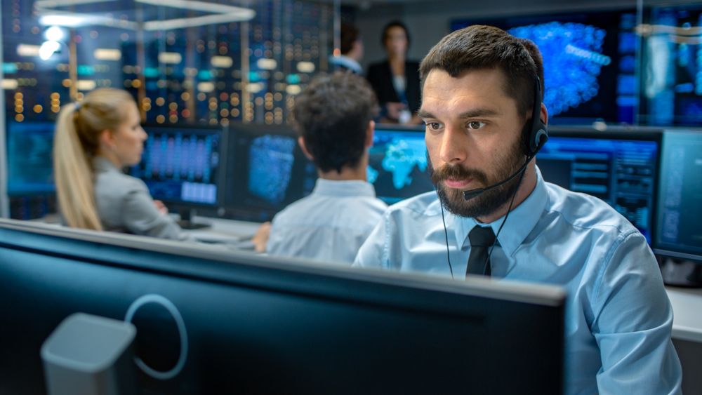 Customer Service Representative Answer Client's Questions in a Headset.