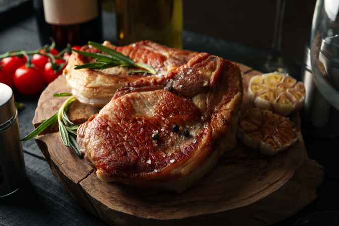 Composition with fried steaks and wine. Grilled food
