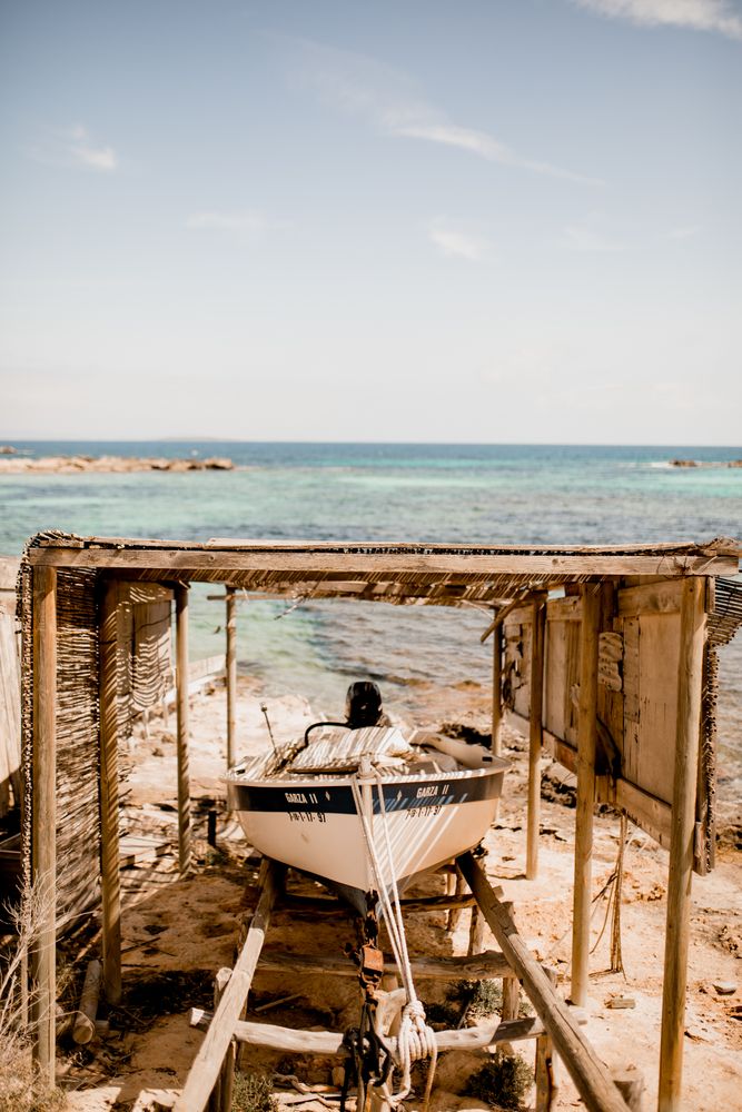 Boat dragged ashore in sunlight